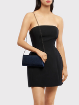 Elegant navy clutch with crystal detailing, magnetic closure, and a shoulder chain, designed for events and smartphone storage.