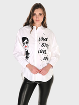 Buttoned shirt featuring a graphic print in off white and black, showcased on a hanger.