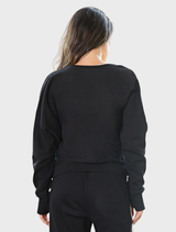 Black sweatshirt displaying "Pirouette & Forget," combining elegance and comfort for dance aficionados.