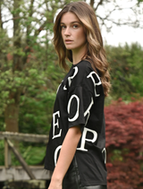 Black T-shirt with the game's name printed in a stylish font across the front.