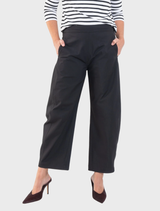 Contemporary black Barrel Leg Pant in Gravitene fabric, designed with a flat-front waistband, elastic back, and side pockets.