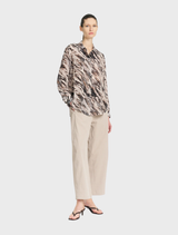 Contemporary fawn Barrel Leg Pant in Gravitene fabric, designed for comfort with a flat front, elastic back, and side pockets.
