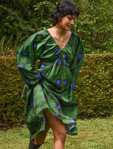 Charming green floral dress showcasing puff sleeves and a flared skirt, suitable for warm weather outings or parties.