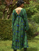 Stylish green floral dress with puff sleeves and a flattering silhouette, perfect for garden parties or casual wear.