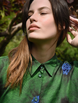  A stylish green shirt adorned with flowers, showcasing the words "Living The Dream" in an eye-catching font.