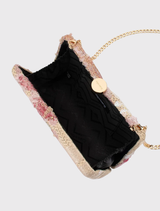 The GRETA Floral Clutch showcases colorful floral designs, a secure hardcase, and includes both acrylic and shoulder chains.