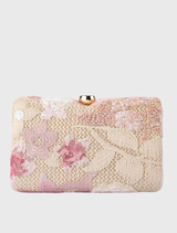 GRETA Floral Clutch, adorned with floral patterns, offers a structured desig