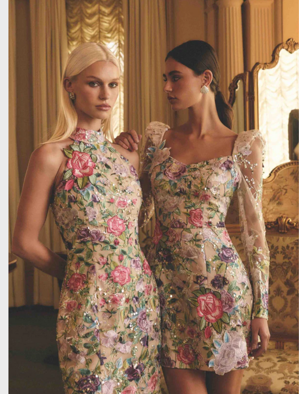 Elegant floral gown crafted from a colorful floral print fabric, highlighting its intricate design and style.