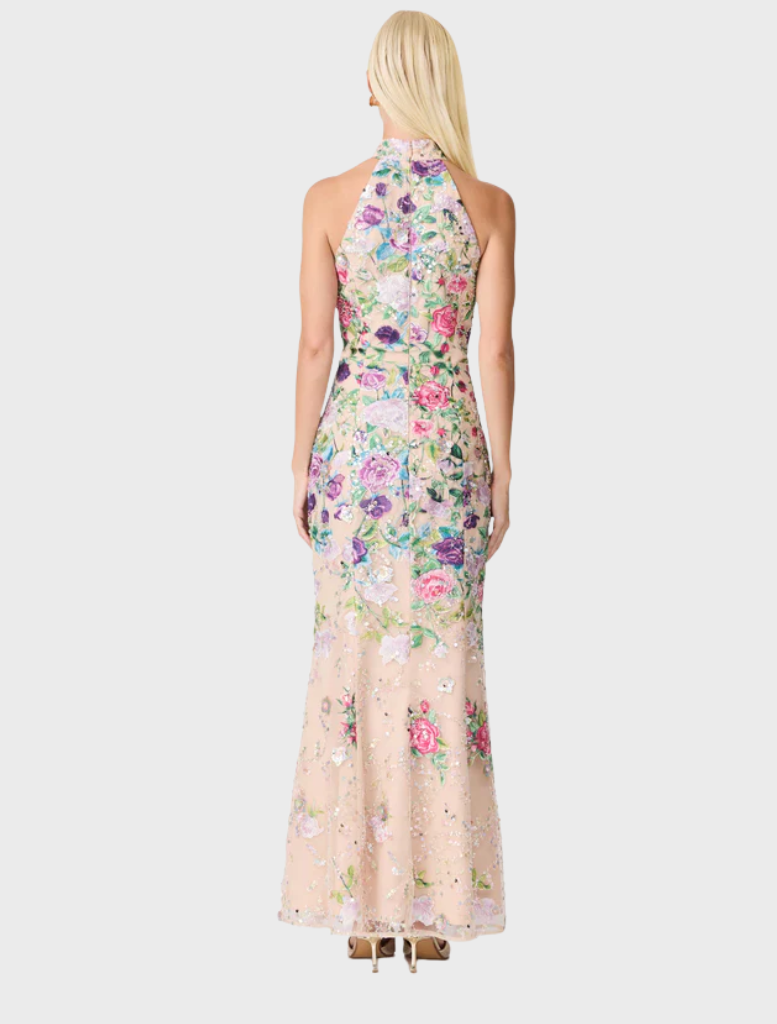 Elegant floral gown crafted from a colorful floral print fabric, highlighting its intricate design and style.
