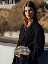 Gold clutch bag with a woven design, made from durable material, ideal for adding elegance to any outfit.