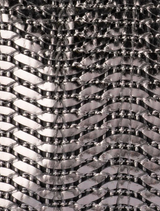 Hannah's gunmetal clutch with a textured finish, ideal for evening events and stylish outings.
