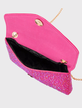 This sophisticated fuchsia shoulder bag, embellished with crystals, boasts a magnetic closure and an internal slip pocket, making it ideal for special events.