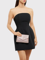 Elegant peach Hattie Crystal Bag featuring crystal details, magnetic closure, and a shoulder chain, perfect for glamorous occasions.