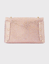 The fashionable Hattie Crystal Bag in peach is embellished with crystals and includes a shoulder chain along with an internal slip pocket designed for smartphones.