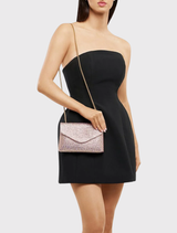 Chic Hattie Crystal Shoulder Bag in peach, adorned with crystals, includes a magnetic closure and a chain for evening wear.