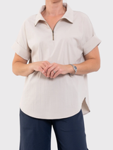 Mela Purdie Half Zip Shirt in Hay, designed with a zip collar, short sleeves, and breathable fabric for ultimate comfort.