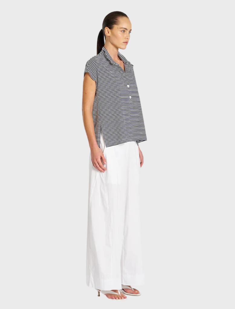 Henley tank top in marine blue and white, featuring a classic button placket and a relaxed fit for casual wear.