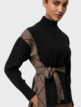 Black chevron-patterned high neck sweater made from a wool-viscose blend, showcasing a stylish and cozy design.