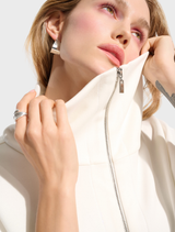 Hip-length jacket in off-white, combining sporty aesthetics with functionality for everyday wear.