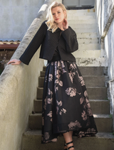 Black and pink skirt featuring a bow detail, showcasing a stylish and playful design suitable for various occasions.
