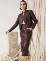  Oxblood leather midi skirt with custom laser cut design, showcasing a unique and stylish silhouette.
