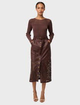 Hypnotic oxblood leather midi skirt with intricate laser cuts, offering a fashionable and eye-catching appearance.