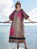 A leopard floral dress with puff sleeves, keyhole neckline, and side pockets, crafted from textured jacquard fabric.