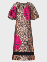 A leopard floral dress with puff sleeves, keyhole neckline, and side pockets, crafted from textured jacquard fabric.