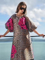 Textured leopard floral dress featuring puff sleeves, a keyhole neckline, and practical side pockets for added convenience.