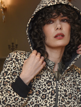 "Ice To Meet You" coat showcases a bold leopard print, designed for both warmth and stylish winter wear.
