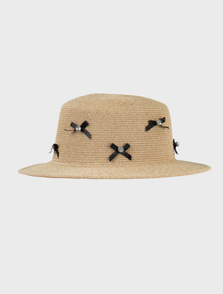 A straw hat adorned with decorative bows, showcasing a stylish and playful design.
