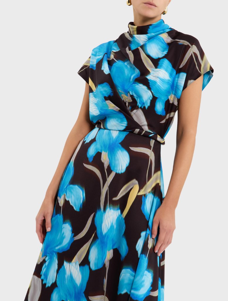 Ingrid midi dress in blue iris floral print, showcasing a stylish design with a fitted top and a flowing skirt for elegance.