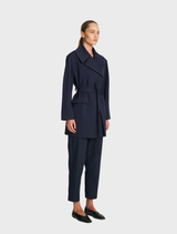 A fashionable ink wrap trench coat showcasing a belted design and a classic collar, suitable for various outfits and seasons.
