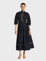 Stylish Olivia dress in dark ink shade, designed with a sleek silhouette and soft fabric for a sophisticated look.