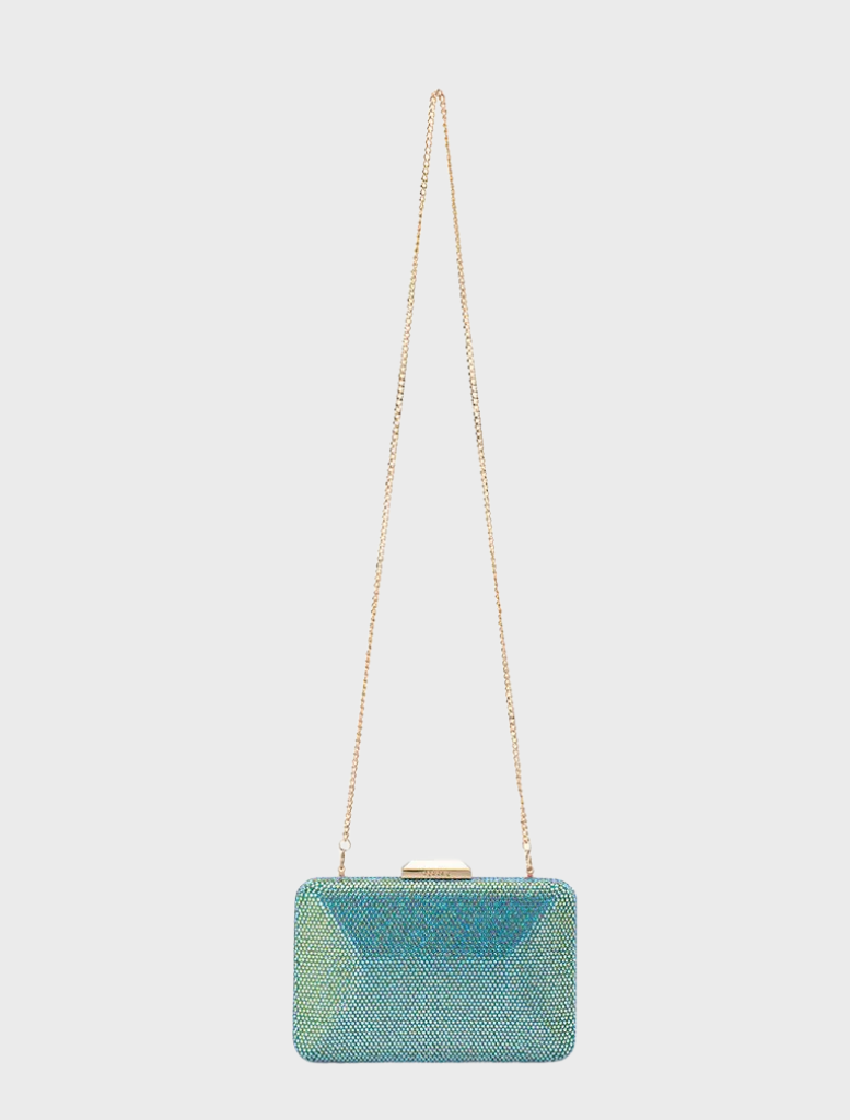 A blue glitter clutch bag with a chain strap, elegantly hanging, labeled as the Edith Iridescent Clutch - Green.