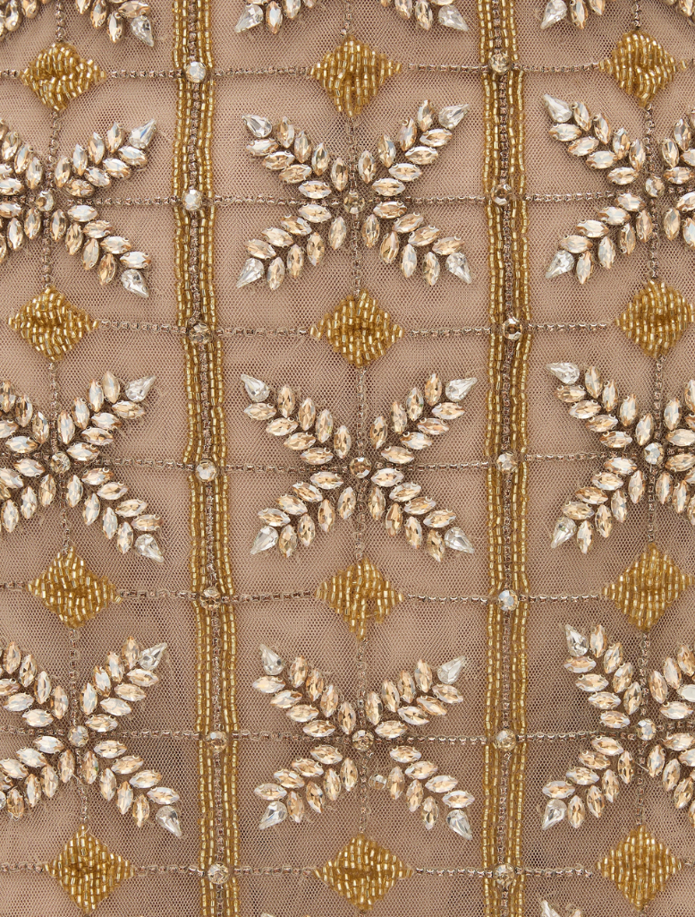  Iris Mini in metallic finish, showcasing a sleek design with a reflective surface and compact size.