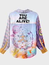 Colorful Isabel shirt displaying sacred geometry and mystical symbols, with bold text celebrating life in gold and orange.