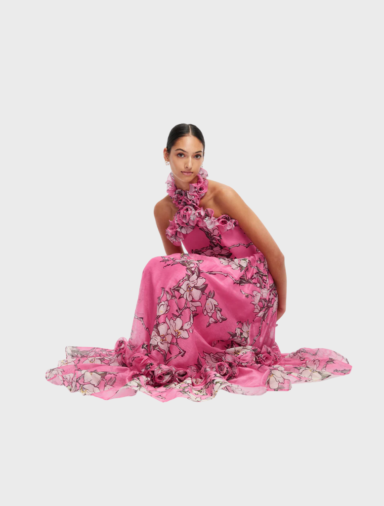 Ruffled halterneck maxi dress in pink magnolia print, combining elegance and style for a chic appearance.
