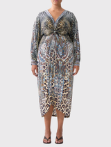 A chic twist front dress displaying an Istanbul Animalia motif, characterized by lively colors and a fashionable silhouette.