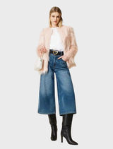 A pink coat draped elegantly, featuring a chic silhouette and smooth texture.