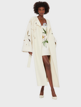 White wool coat with long sleeves and a belt, perfect for stylish warmth in cooler weather.