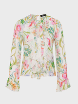 Elegant ivory top adorned with a floral design, suitable for various stylish outfits.