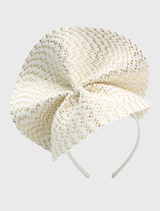 Chic ivory gold fascinator with a wavy plate trim, designed for easy wear on a headband, suitable for various occasions.