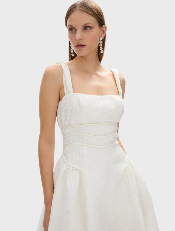 Elegant ivory strap dress by Sophia, showcasing a tailored fit and a graceful, flowing silhouette for special occasions.