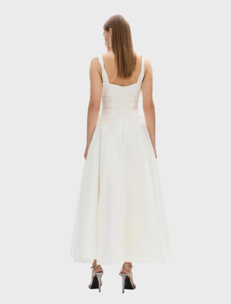  Ivory Sophia strap dress with a sleek design, ideal for formal events, featuring a fitted top and a flowing bottom.