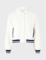 White cropped jacket featuring navy stripes.
