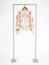 A multi-colored Mozarella jacket displayed on a hanger, showcasing its unique design and fabric texture.