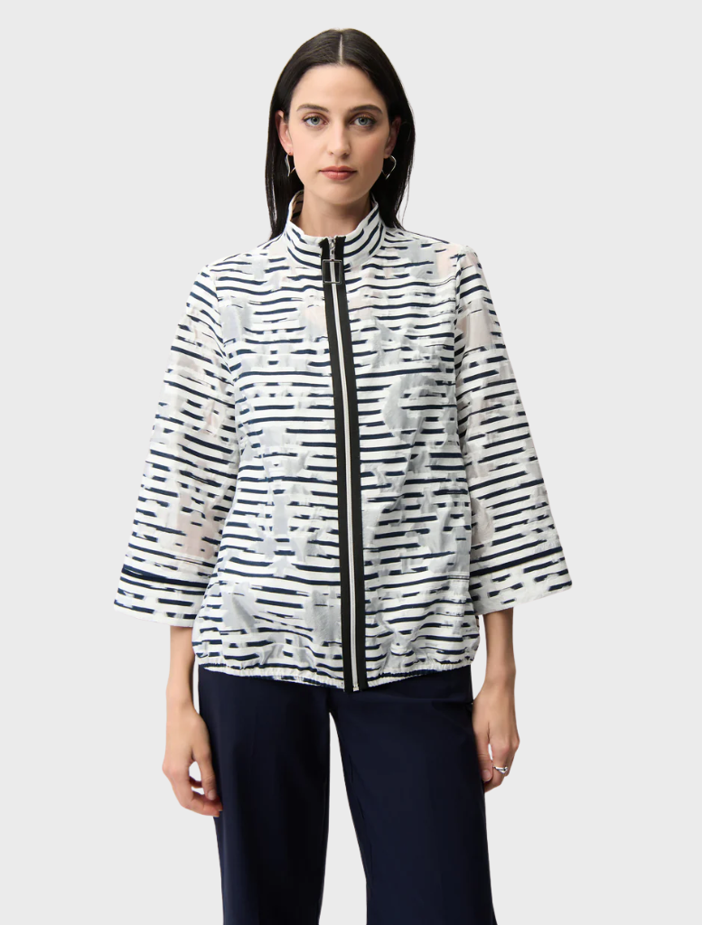 Off-white and navy jacket displayed on a hanger, showcasing a stylish and modern design suitable for casual wear.