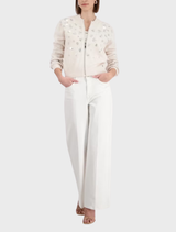 Stylish champagne beige jacket featuring unique jewelry embellishments, ideal for adding sophistication to your wardrobe.