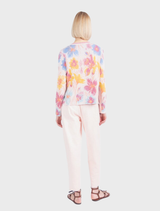Light pink cardigan with a jacquard floral design, made from a viscose-cotton blend, offering a soft and breathable feel.